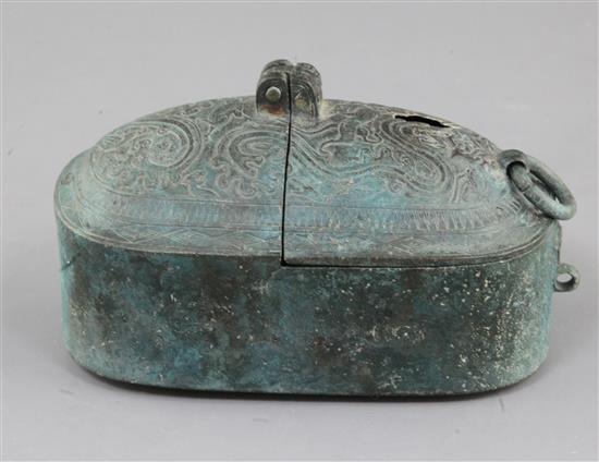 A Chinese archaic bronze portable lamp, Han dynasty, 2nd century B.C.- 2nd century A.D. 15cm long, hole to cover